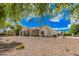 Beautiful single-story home boasts a well-maintained front yard and charming architectural details at 21615 E Pegasus Pkwy, Queen Creek, AZ 85142