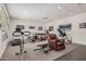 Home gym featuring recessed lighting, view to pool area, and various exercise machines at 21615 E Pegasus Pkwy, Queen Creek, AZ 85142