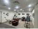Home gym featuring recessed lighting, view to pool area, and various exercise machines at 21615 E Pegasus Pkwy, Queen Creek, AZ 85142