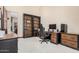 Home office space with shelving, desk and a comfortable gaming chair at 21615 E Pegasus Pkwy, Queen Creek, AZ 85142