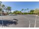 Outdoor basketball court surrounded by trees and landscaping provides ample space for recreational activities at 2239 S Cottonwood --, Mesa, AZ 85202