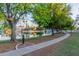 Beautiful community pond with a sidewalk and lush green surroundings, enhancing the appeal of outdoor living at 2239 S Cottonwood --, Mesa, AZ 85202