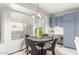Cozy dining area with a round table, a large window, and built-in cabinets at 2239 S Cottonwood --, Mesa, AZ 85202