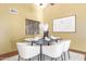 Dining area with modern table and seating, complemented by a window and contemporary artwork at 2239 S Cottonwood --, Mesa, AZ 85202
