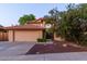 Charming two-story home featuring a well-maintained yard, terracotta roof, and an attached two-car garage at 2239 S Cottonwood --, Mesa, AZ 85202