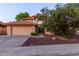 Charming two-story home featuring a well-maintained yard, terracotta roof, and an attached two-car garage at 2239 S Cottonwood --, Mesa, AZ 85202