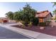 Charming home featuring a well-maintained yard, terracotta roof, and desert landscaping at 2239 S Cottonwood --, Mesa, AZ 85202