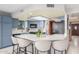 Stylish kitchen featuring an island with white quartz countertops and bar stool seating at 2239 S Cottonwood --, Mesa, AZ 85202
