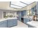 Bright kitchen featuring a white quartz countertop island, modern appliances, and ample cabinet space at 2239 S Cottonwood --, Mesa, AZ 85202