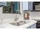 Close-up of a stainless steel sink and faucet with white quartz countertops at 2239 S Cottonwood --, Mesa, AZ 85202