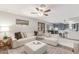 Inviting living room featuring a comfortable sectional sofa and a view of the kitchen area at 2239 S Cottonwood --, Mesa, AZ 85202