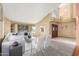 Open-concept living room with high ceilings and comfortable seating adjacent to the front entryway at 2239 S Cottonwood --, Mesa, AZ 85202