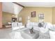 Comfortable seating area with vaulted ceilings and a dining area with wood beam detail nearby at 2239 S Cottonwood --, Mesa, AZ 85202