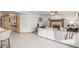 Open living area featuring a cozy fireplace, a plush white sofa, and tile flooring at 2239 S Cottonwood --, Mesa, AZ 85202