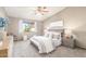 Serene main bedroom featuring a comfortable bed, a large window, and neutral decor at 2239 S Cottonwood --, Mesa, AZ 85202