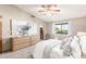 Spacious main bedroom featuring a ceiling fan, neutral tones, and a comfortable queen-sized bed at 2239 S Cottonwood --, Mesa, AZ 85202