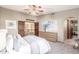 Comfortable main bedroom with carpet, an adjacent bathroom and closet, and lots of natural light at 2239 S Cottonwood --, Mesa, AZ 85202
