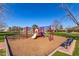 Community playground with slides, swings, and climbing structures on a wood chip surface at 2239 S Cottonwood --, Mesa, AZ 85202