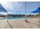 Large community pool featuring sun shades and a spacious sun deck for residents to enjoy a resort-like experience at 2239 S Cottonwood --, Mesa, AZ 85202