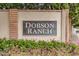 Dobson Ranch sign with colorful flowers, green plants, brick accents, and greenery in the background at 2239 S Cottonwood --, Mesa, AZ 85202