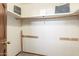 Walk-in closet with shelving and clothing rods, ready for organizing all your favorite things at 2239 S Cottonwood --, Mesa, AZ 85202
