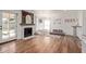 Cozy bonus room with a fireplace, playroom area, and hardwood floors at 2305 E Millbrae Ct, Gilbert, AZ 85234