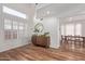 Bright living room with a large window and modern decor leading into the dining room at 2305 E Millbrae Ct, Gilbert, AZ 85234