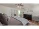 Cozy main bedroom featuring hardwood floors, black dresser, and king size bed at 2305 E Millbrae Ct, Gilbert, AZ 85234