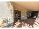Covered patio featuring brick flooring and gray French doors at 2305 E Millbrae Ct, Gilbert, AZ 85234