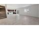 Bright, open-concept living area with tile floors, a staircase, and natural light at 2428 S 246Th Ln, Buckeye, AZ 85326