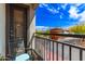 Cozy balcony with chair and scenic views of landscaping and blue skies at 2727 N Price Rd # 3, Chandler, AZ 85224