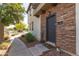 Inviting front entrance with stone accents, a welcome mat, and desert landscaping at 2727 N Price Rd # 3, Chandler, AZ 85224