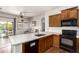 Bright kitchen featuring stainless steel appliances, white countertops, and hardwood floors at 2727 N Price Rd # 3, Chandler, AZ 85224