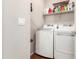 Bright laundry room with white washer and dryer and upper shelf for storage at 2727 N Price Rd # 3, Chandler, AZ 85224
