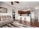 Spacious living area featuring hardwood floors, an open kitchen, and comfortable seating at 2727 N Price Rd # 3, Chandler, AZ 85224