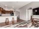 Open-concept living area with hardwood floors, a kitchen, and modern decor at 2727 N Price Rd # 3, Chandler, AZ 85224