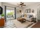 Comfortable living room featuring balcony access, stylish decor, and natural light at 2727 N Price Rd # 3, Chandler, AZ 85224
