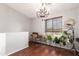 A bright office features a chandelier, wood-look blinds, and lush plants at 2727 N Price Rd # 3, Chandler, AZ 85224