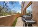 Outdoor balcony perfect for grilling with an outdoor table and seating, offering a private space to enjoy fresh air and views at 28990 N White Feather Ln # 121, Scottsdale, AZ 85262