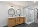 Bathroom boasts double vanity, a glass-enclosed shower, modern fixtures, and a clean design that offers a spa-like retreat at 28990 N White Feather Ln # 121, Scottsdale, AZ 85262