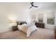 Inviting bedroom with neutral decor, a comfortable bed, and bright windows offering natural light and serene views at 28990 N White Feather Ln # 121, Scottsdale, AZ 85262
