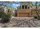 Attractive two-story home featuring a two-car garage and stone accents at 28990 N White Feather Ln # 121, Scottsdale, AZ 85262