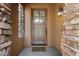 Close up of the front door surrounded by stone detail at 28990 N White Feather Ln # 121, Scottsdale, AZ 85262