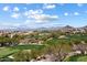 Expansive golf course in a desert community with stunning mountain views, featuring rolling greens and natural vegetation at 28990 N White Feather Ln # 121, Scottsdale, AZ 85262
