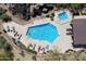 Overhead view of a sparkling pool and hot tub with lounge chairs for relaxing in a picturesque desert setting at 28990 N White Feather Ln # 121, Scottsdale, AZ 85262