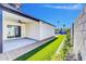 Back patio and yard featuring a covered patio area, artificial grass, and beautifully landscaped perimeter at 2926 N 16Th Ave, Phoenix, AZ 85015