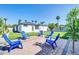 Inviting backyard patio area with a seating area, green grass, and lush landscaping at 2926 N 16Th Ave, Phoenix, AZ 85015
