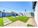 Private backyard featuring a artificial lawn, patio, and comfortable seating, perfect for outdoor enjoyment at 2926 N 16Th Ave, Phoenix, AZ 85015