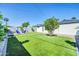 Lush backyard featuring green grass, decorative brickwork, and comfortable outdoor seating at 2926 N 16Th Ave, Phoenix, AZ 85015