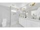 Modern bathroom features double vanity, luxurious shower, and stylish fixtures with marble floors and tiling at 2926 N 16Th Ave, Phoenix, AZ 85015